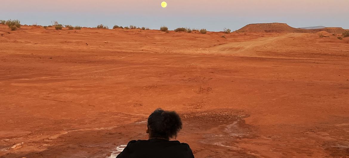 Asmaa Niang looks across an arid desert — COP16 Sport4Land
